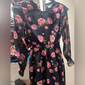 Floral dress with pink and purplele flowers and a dark blue background
